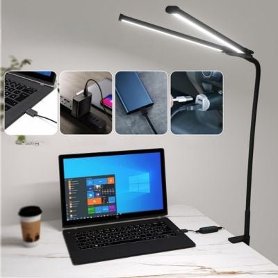 lampe de bureau à double bras orientables éclairant un espace de travail large