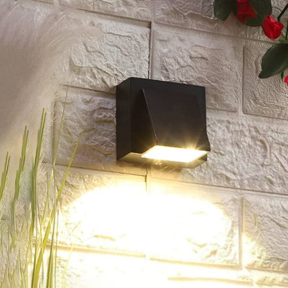 Luminaire extérieur applique murale exterieur design sur mur  pierre diffusant lumière chaude vers le bas